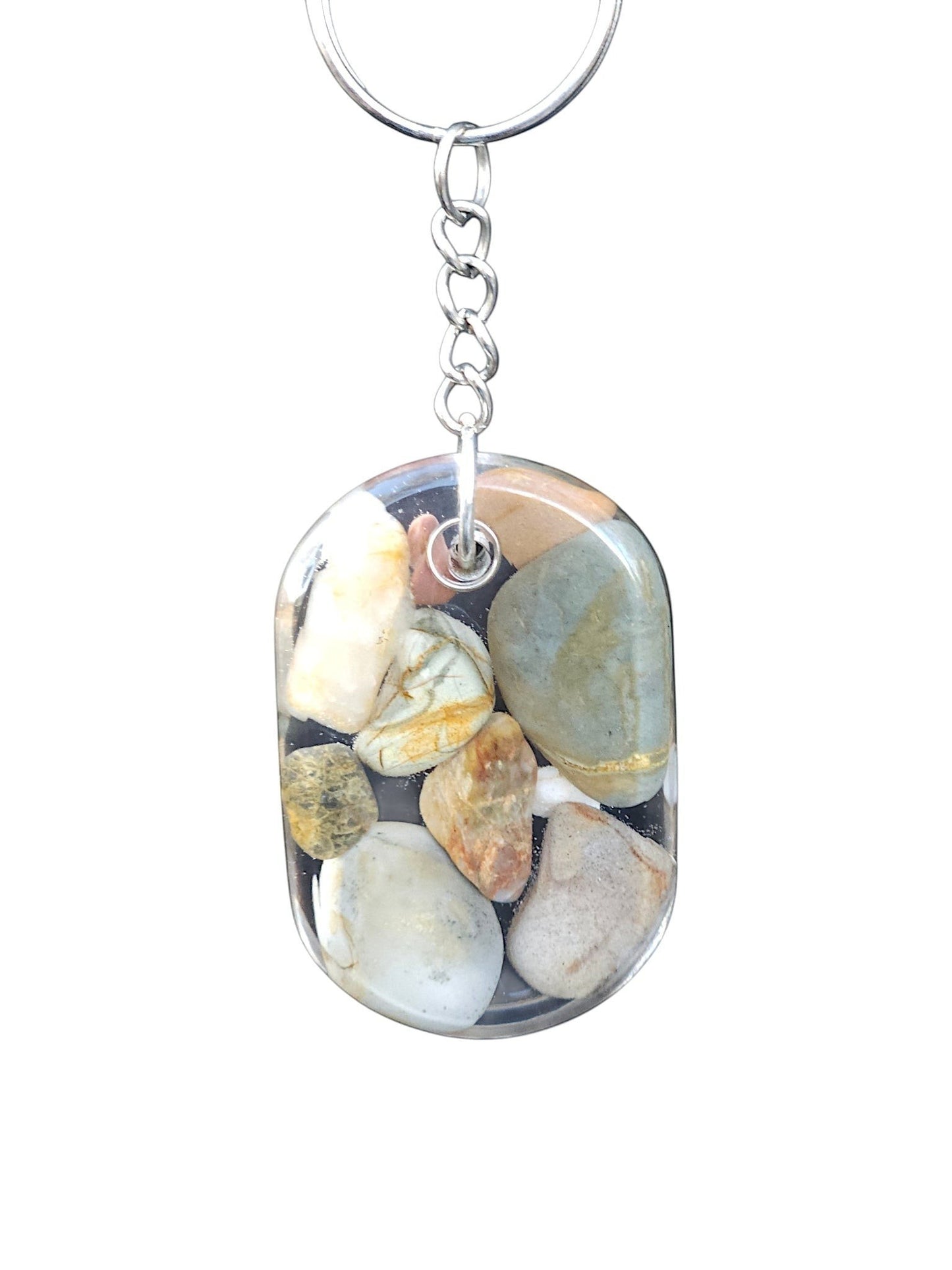 Nature's Stash oval resin keyring featuring hand-polished natural gemstones and petrified wood on a silver split ring.