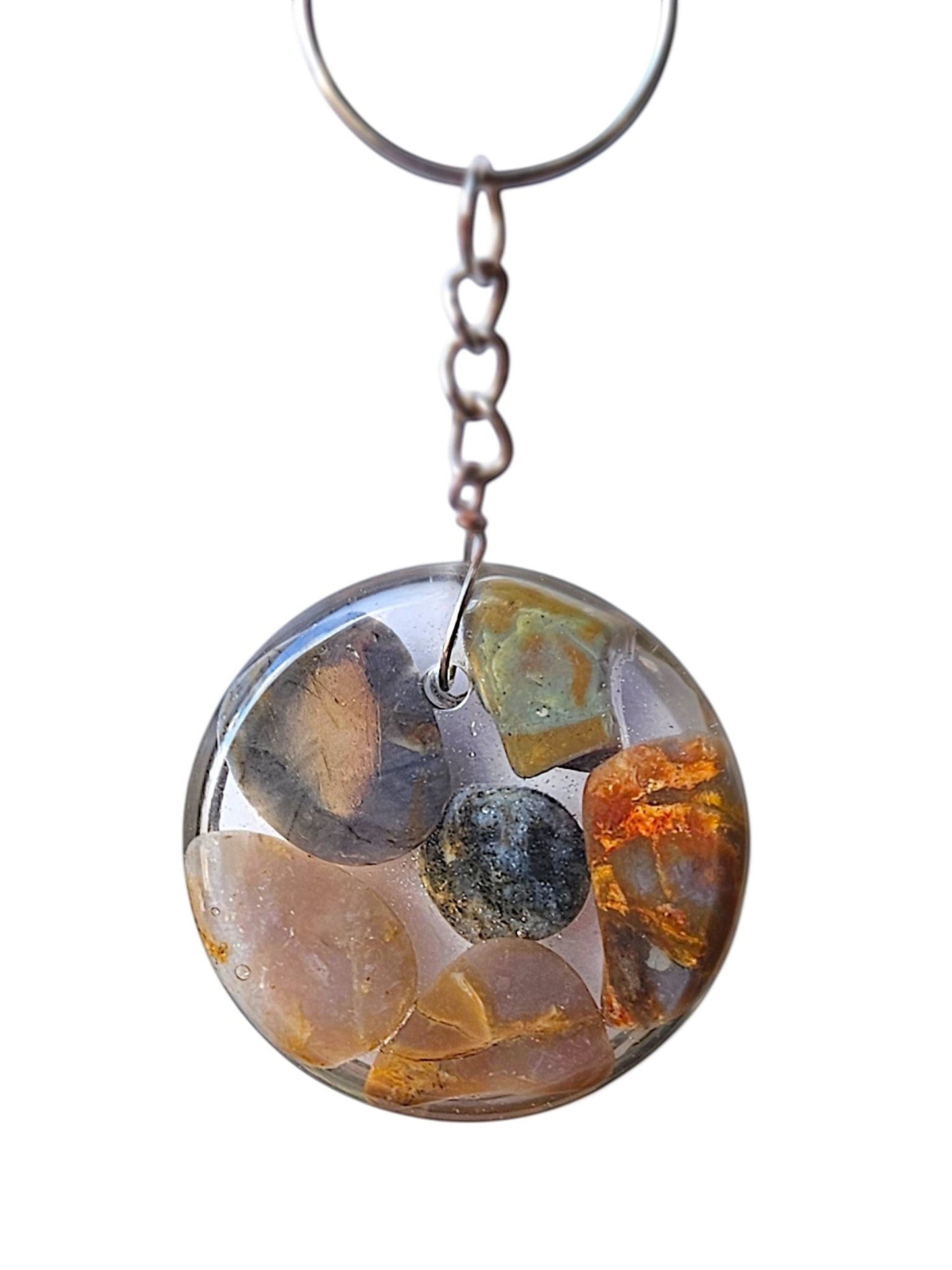 Nature's Stash round resin keyring featuring embedded hand-polished natural gemstones and petrified wood.