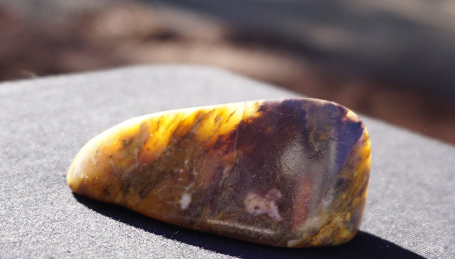 Hand-cut and polished Bucca Jasper freeform with gold, burgundy and purple tones, one-of-a-kind Australian stone