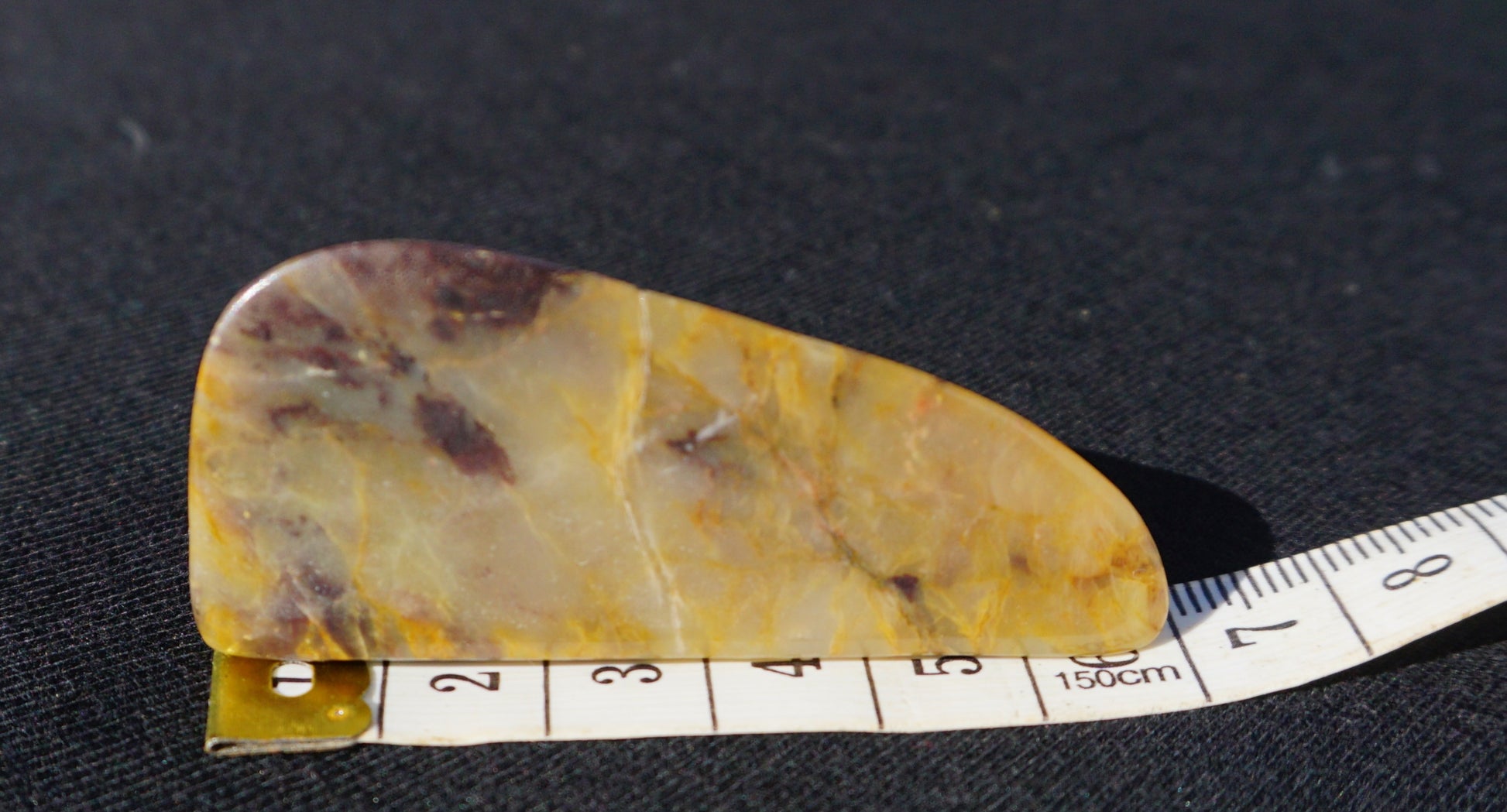 Hand-cut and polished Bucca Jasper freeform with gold, burgundy and purple tones, one-of-a-kind Australian stone