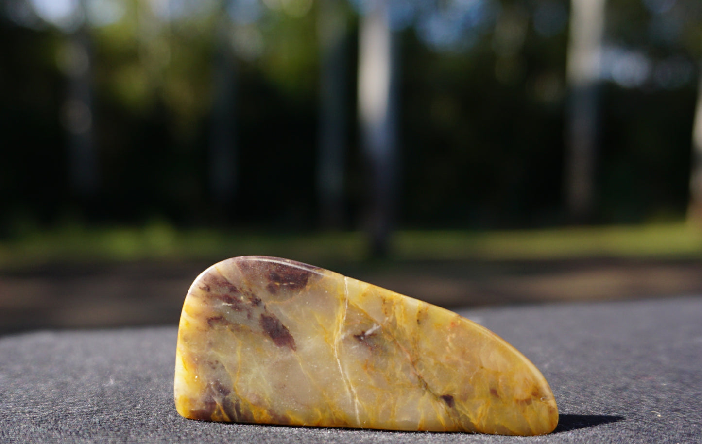 Hand-cut and polished Bucca Jasper freeform with gold, burgundy and purple tones, one-of-a-kind Australian stone