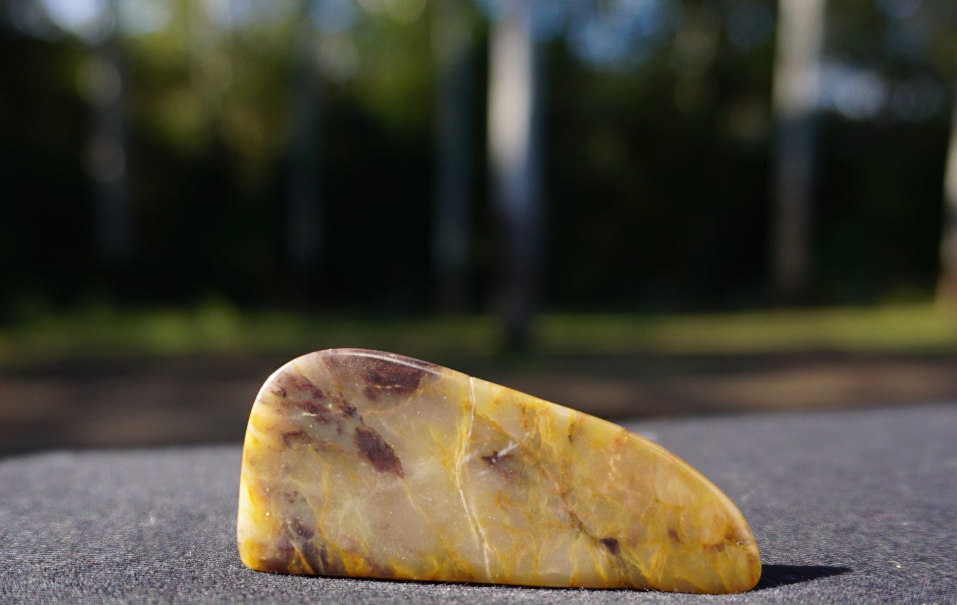 Hand-cut and polished Bucca Jasper freeform with gold, burgundy and purple tones, one-of-a-kind Australian stone
