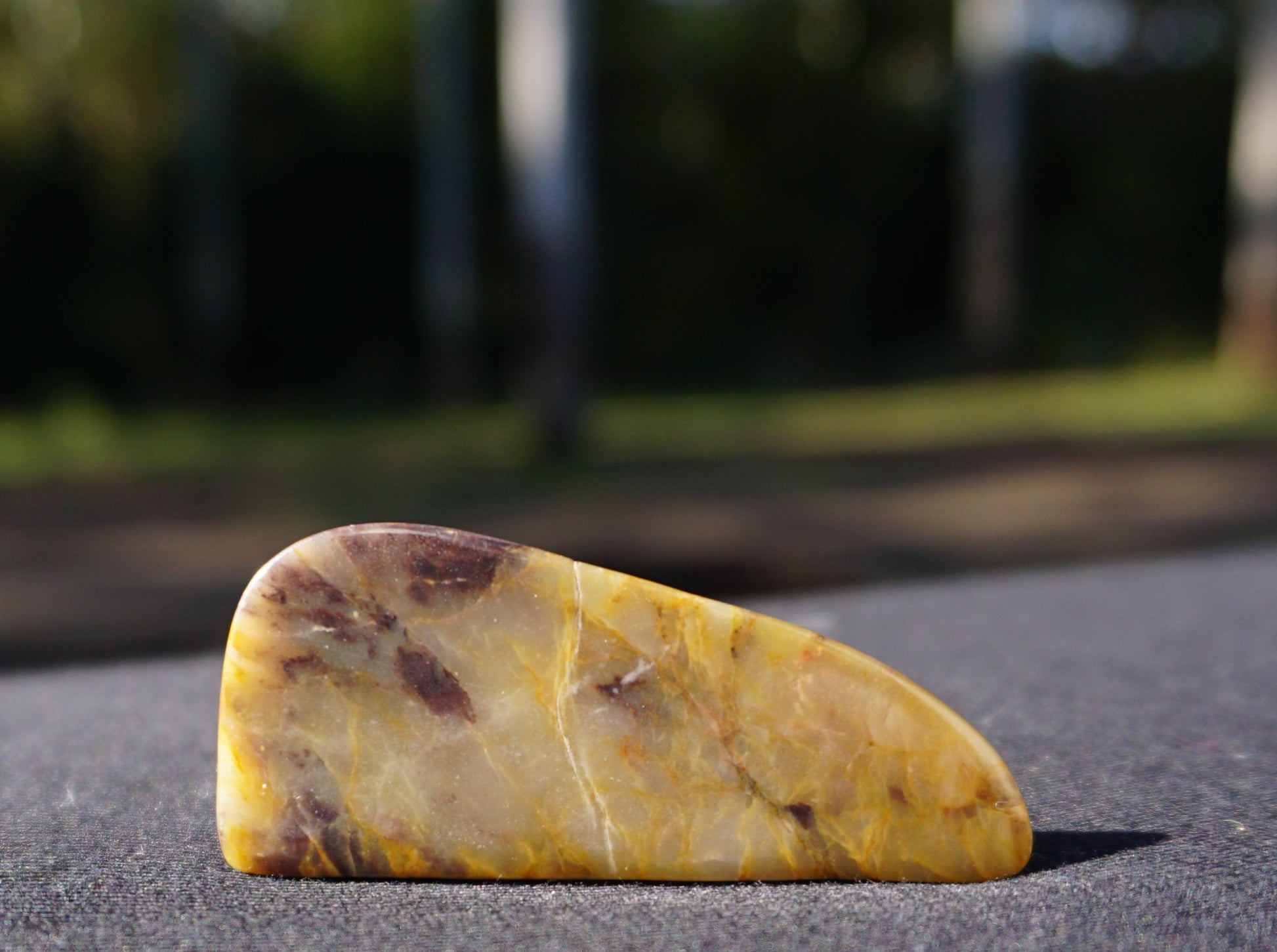 Hand-cut and polished Bucca Jasper freeform with gold, burgundy and purple tones, one-of-a-kind Australian stone