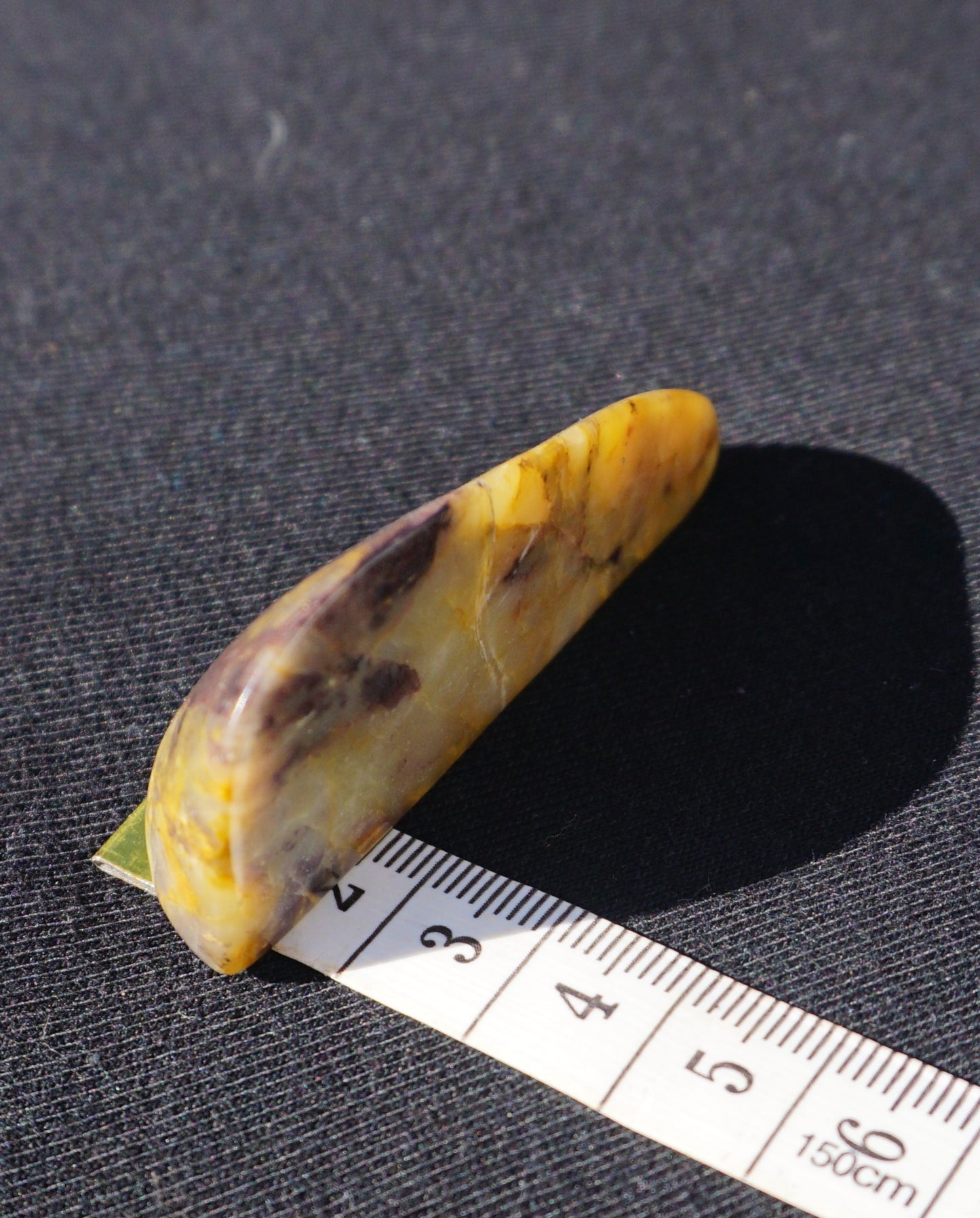 Hand-cut and polished Bucca Jasper freeform with gold, burgundy and purple tones, one-of-a-kind Australian stone